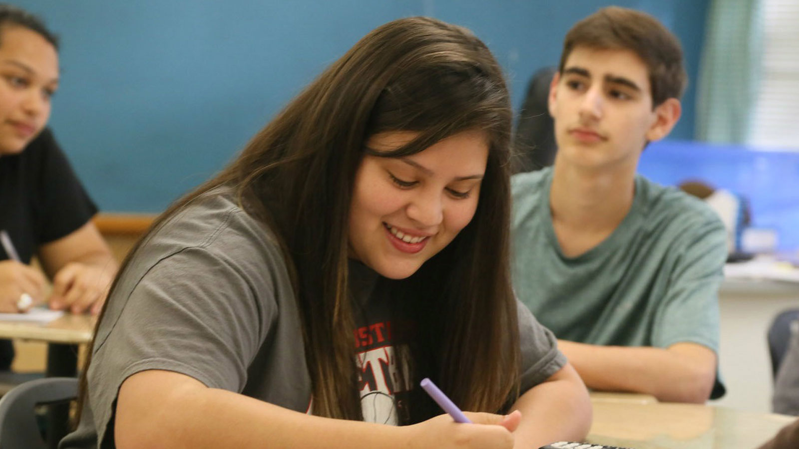 A student works on an assignment in class