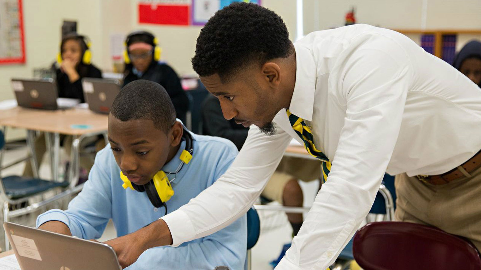 A teacher focused on formative assessments reviews a student's work.