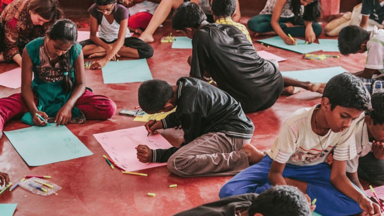 Students in India working on a classroom project