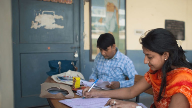 Teachers in India working on lesson plans