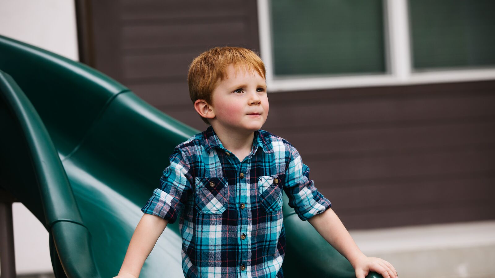 A foster child on a slide in Central Texas