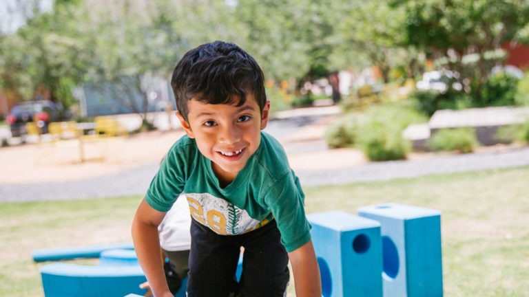 Child playing outside benefits from pediatric care in Central Texas