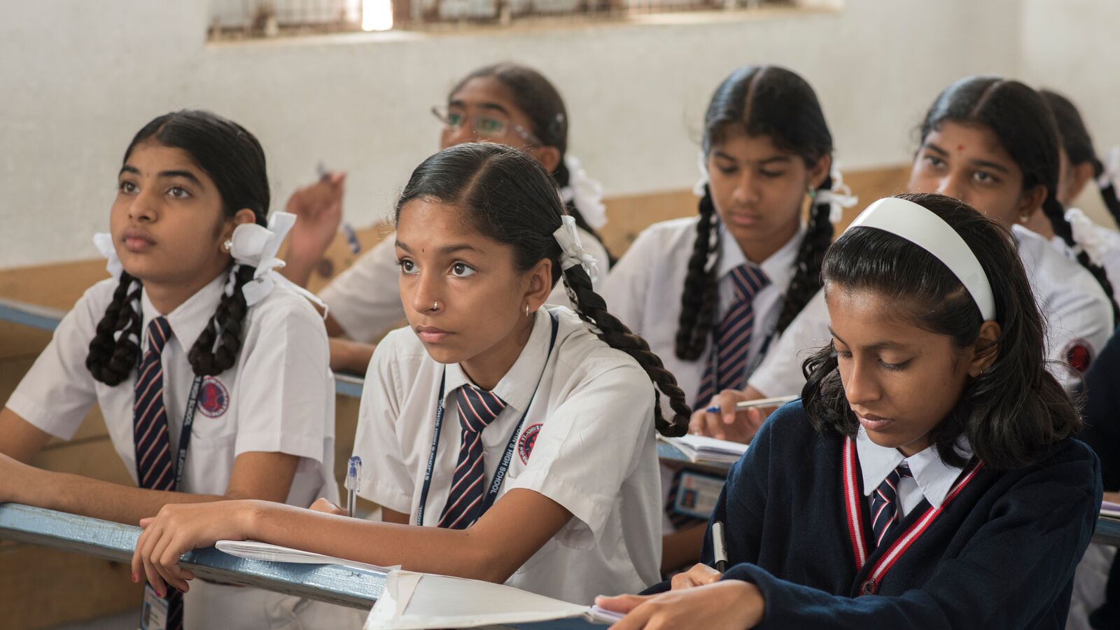 Indian school children who benefit from social impact investing