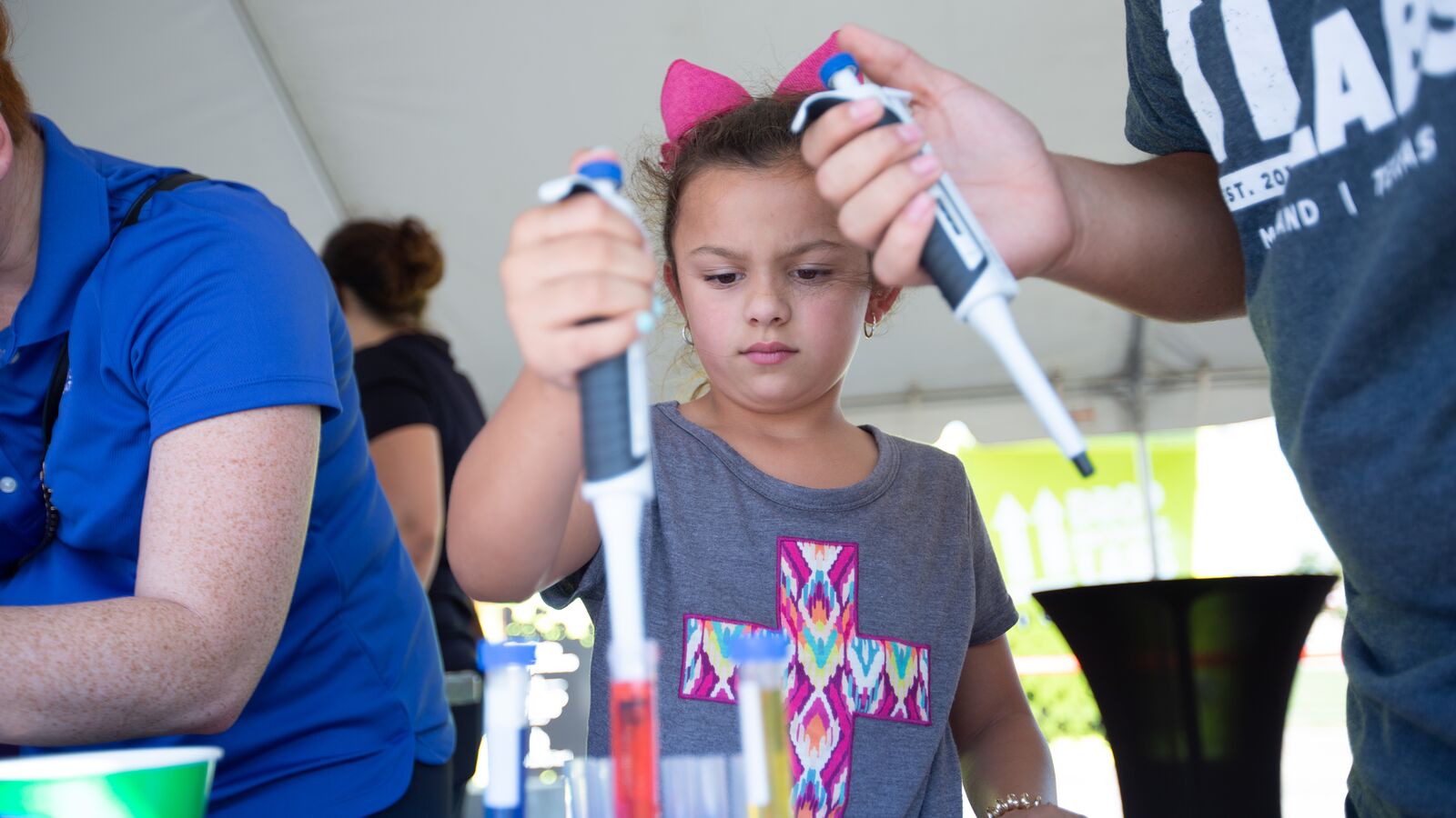 A student participates in a project at the Learning Undefeated mobile science laboratory.