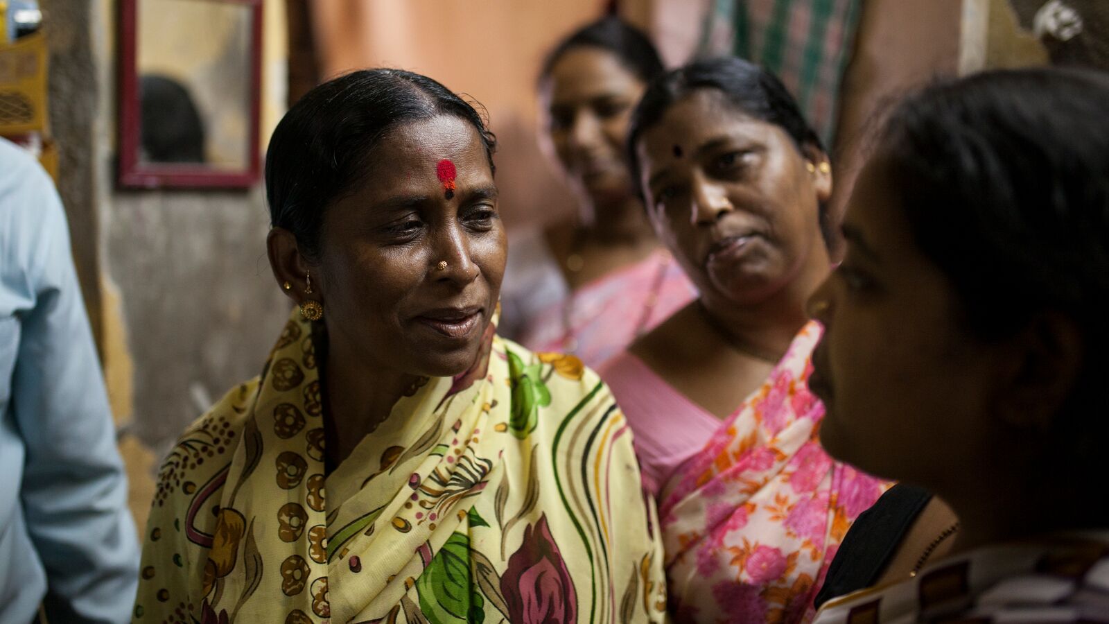 Several women stand together in a group in a Svasti office in India