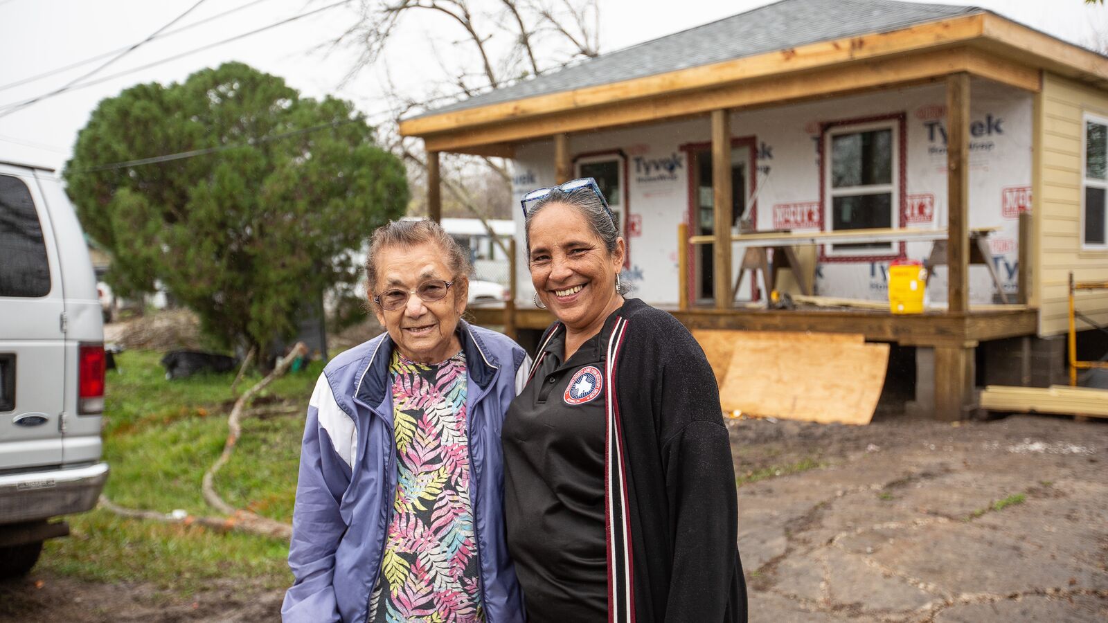 Dominga Hernandez from Placedo, Texas, stands next to her case manager, Theresa Martinez, who works with the Victoria Long Term Recovery Group.