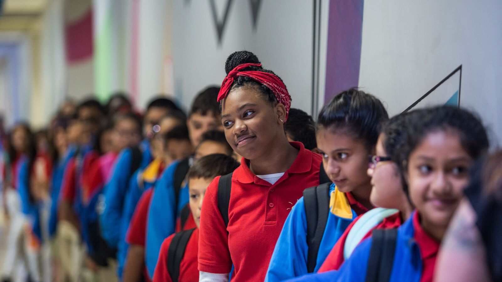 Students line up in the hallway in an American public school.