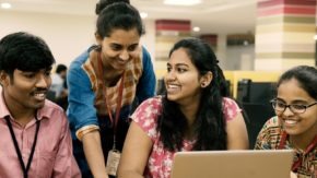 Foundation for Excellence scholarship recipient Supreeta works in a classroom with other university students.