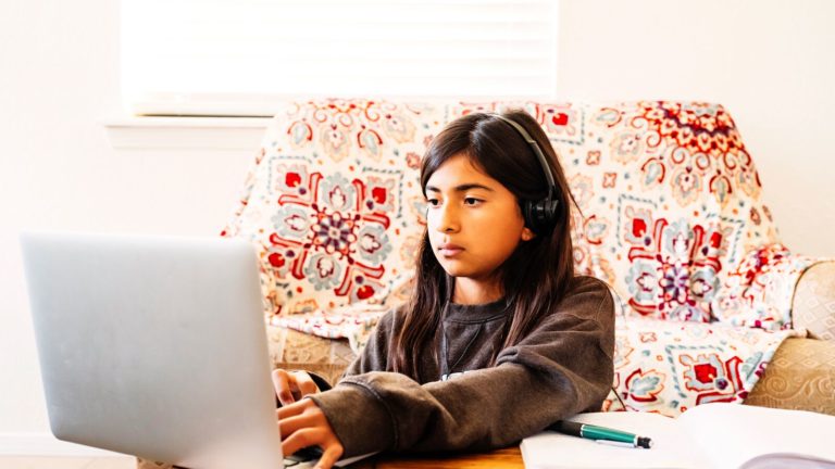 Girl Doing Her Homework on Computer