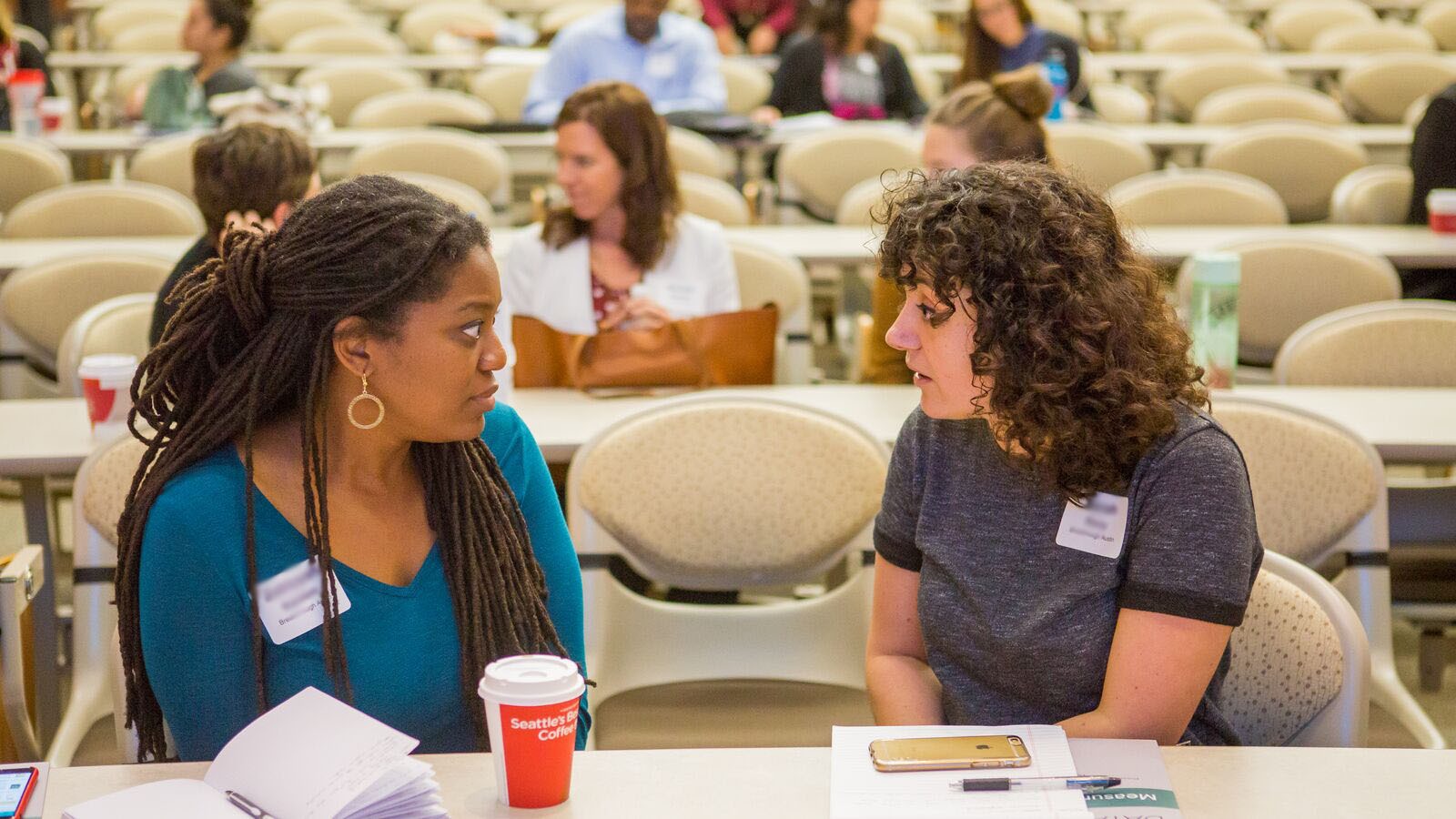 Two women at a Good Measure event talk to each other