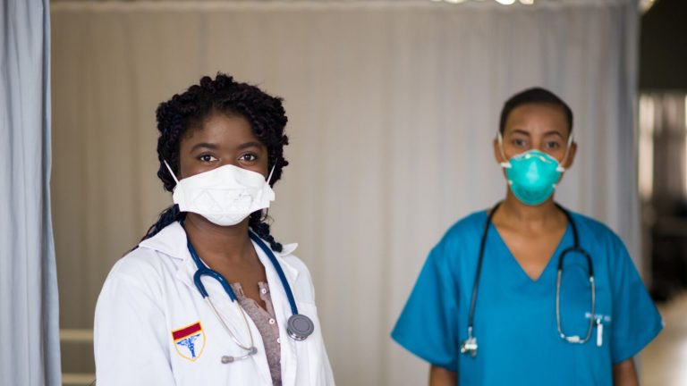 Frontline healthcare workers wearing a protective mask