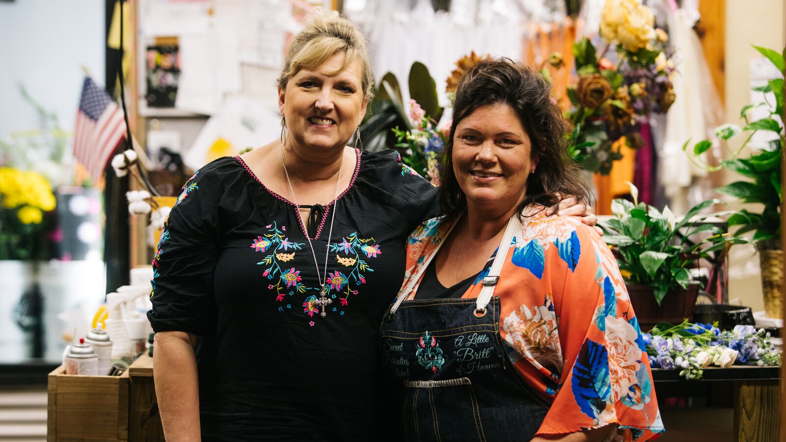 Small business owner Dana Alsop and florist Melodie Friedrichs mark the reopening of their event space and floral shop in Refugio.