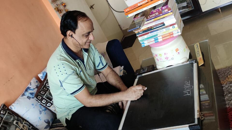 A teacher uses Masoom's virtual classroom technology to teach his students during COVID-19.