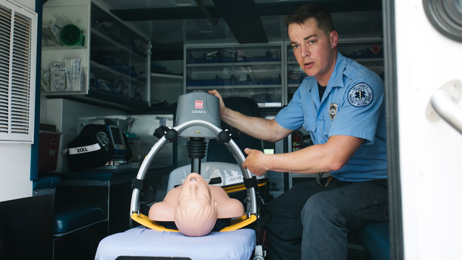 An emergency responder with Tri-County EMS demonstrates the CPR machine outfitting this ambulance.