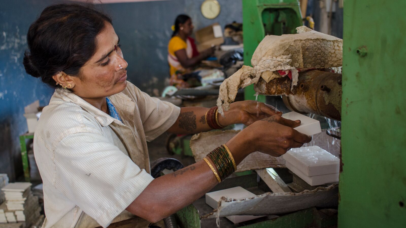 An employee of Ascent Industries works at her station. The company is supported by Kinara Capital.