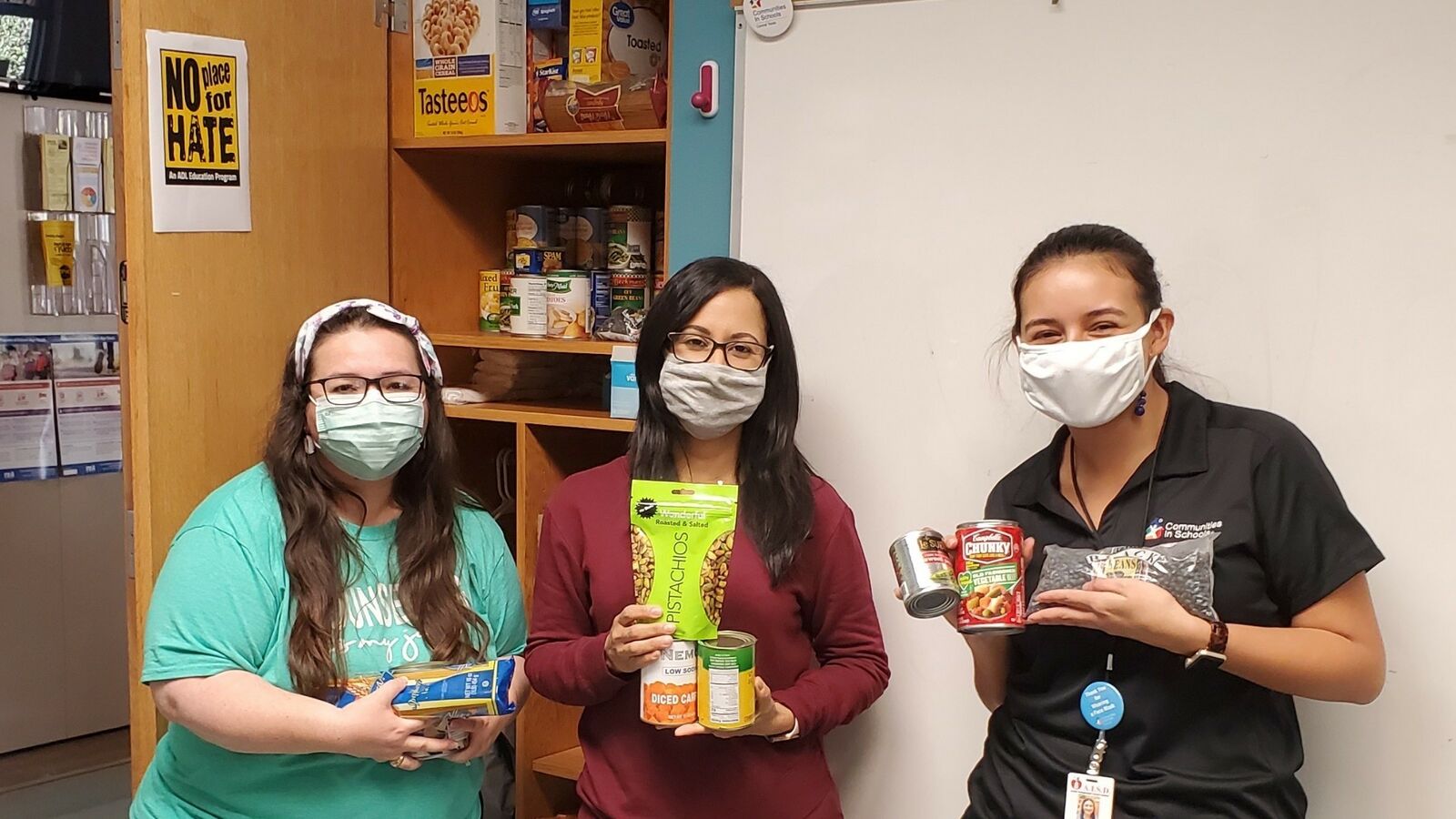 Staff and volunteers from Communities in Schools of Central Texas collect food donations for families impacted by COVID-19.