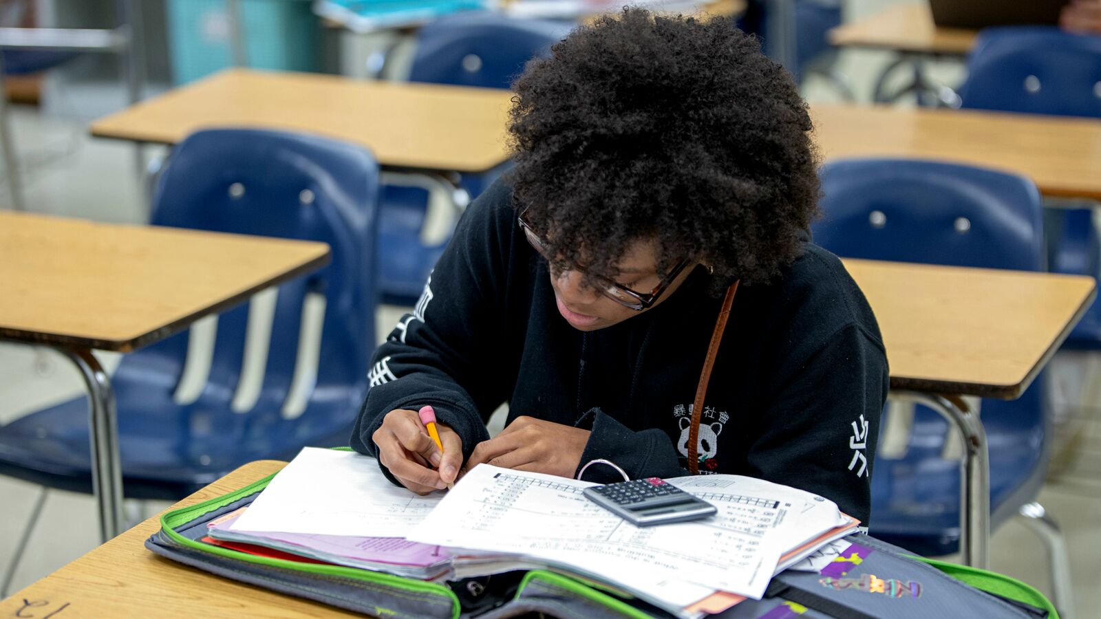 A Central Texas student studies in an advanced level math course