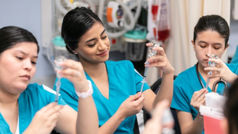 Students studying in ACC's accelerated nursing program practice medical skills