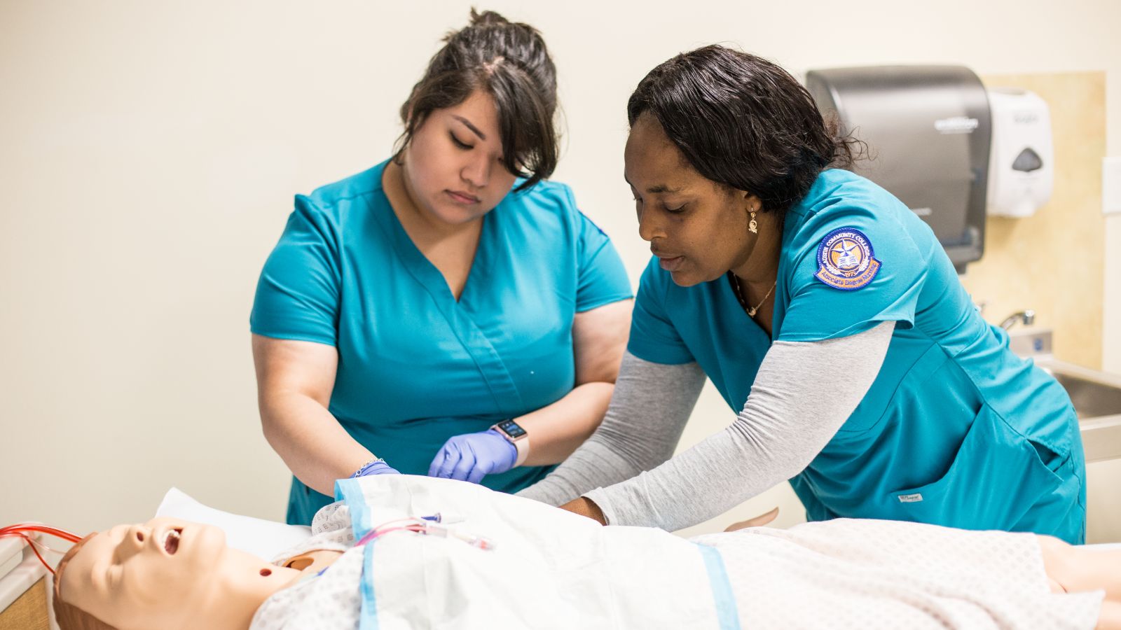 Students studying in ACC's accelerated nursing program practice medical skills