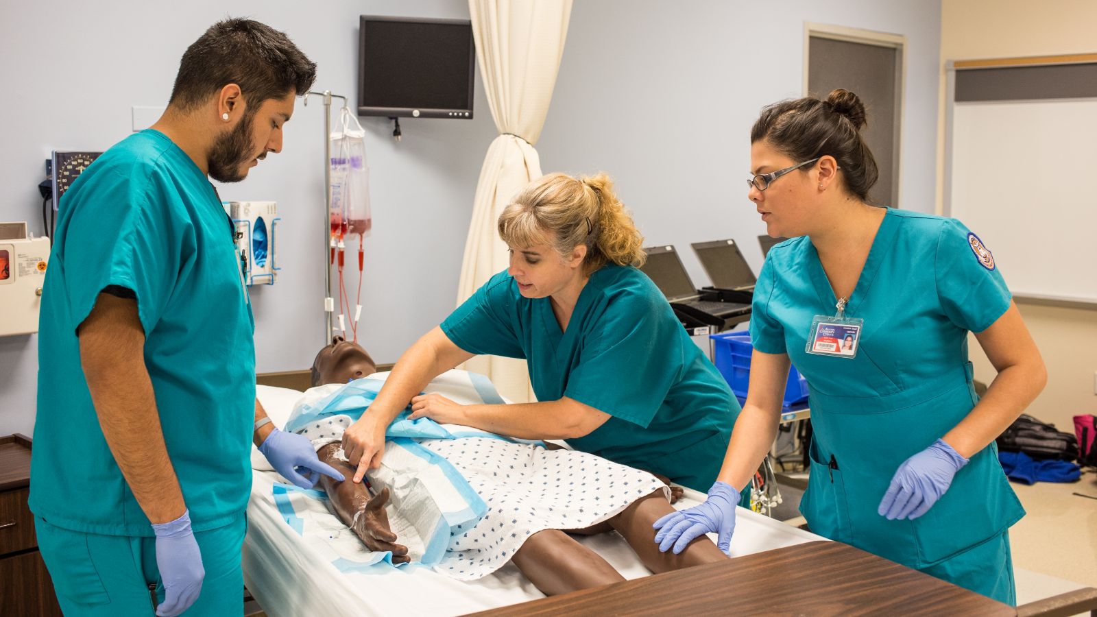 Students studying in ACC's accelerated nursing program practice medical skills