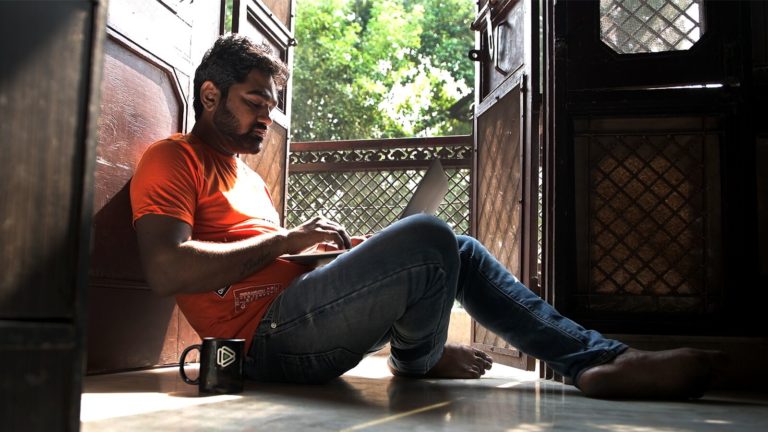 A gig worker named Akash uses Workex while sitting in his home in India