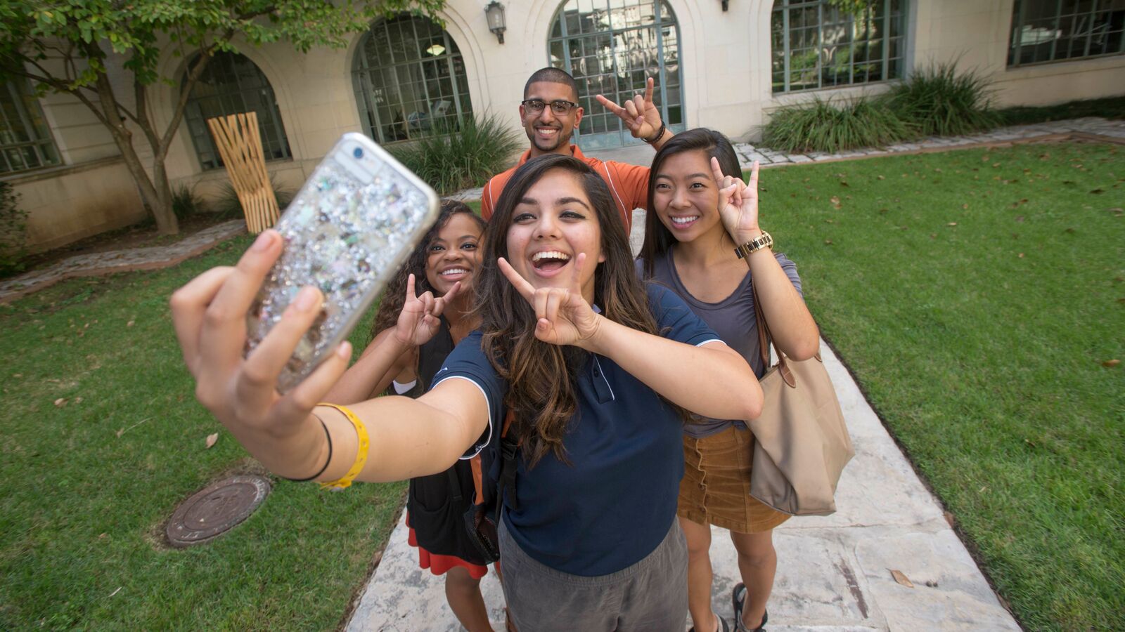 UT Austin students take a selfie on campus
