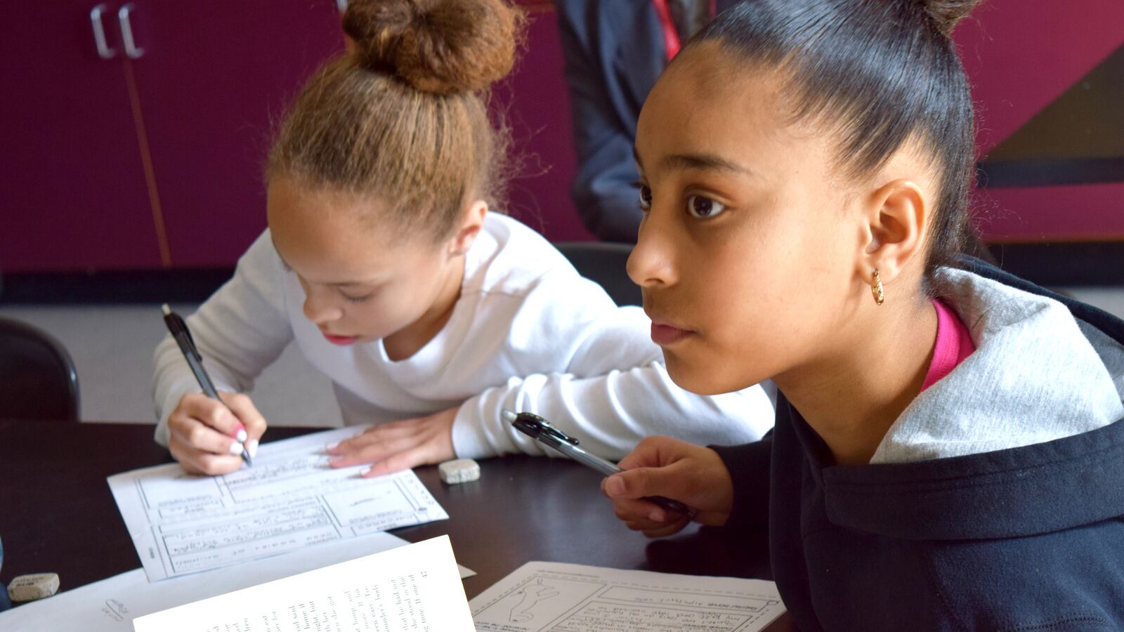 Two students work on an assignment in a Rhode Island School District classroom.