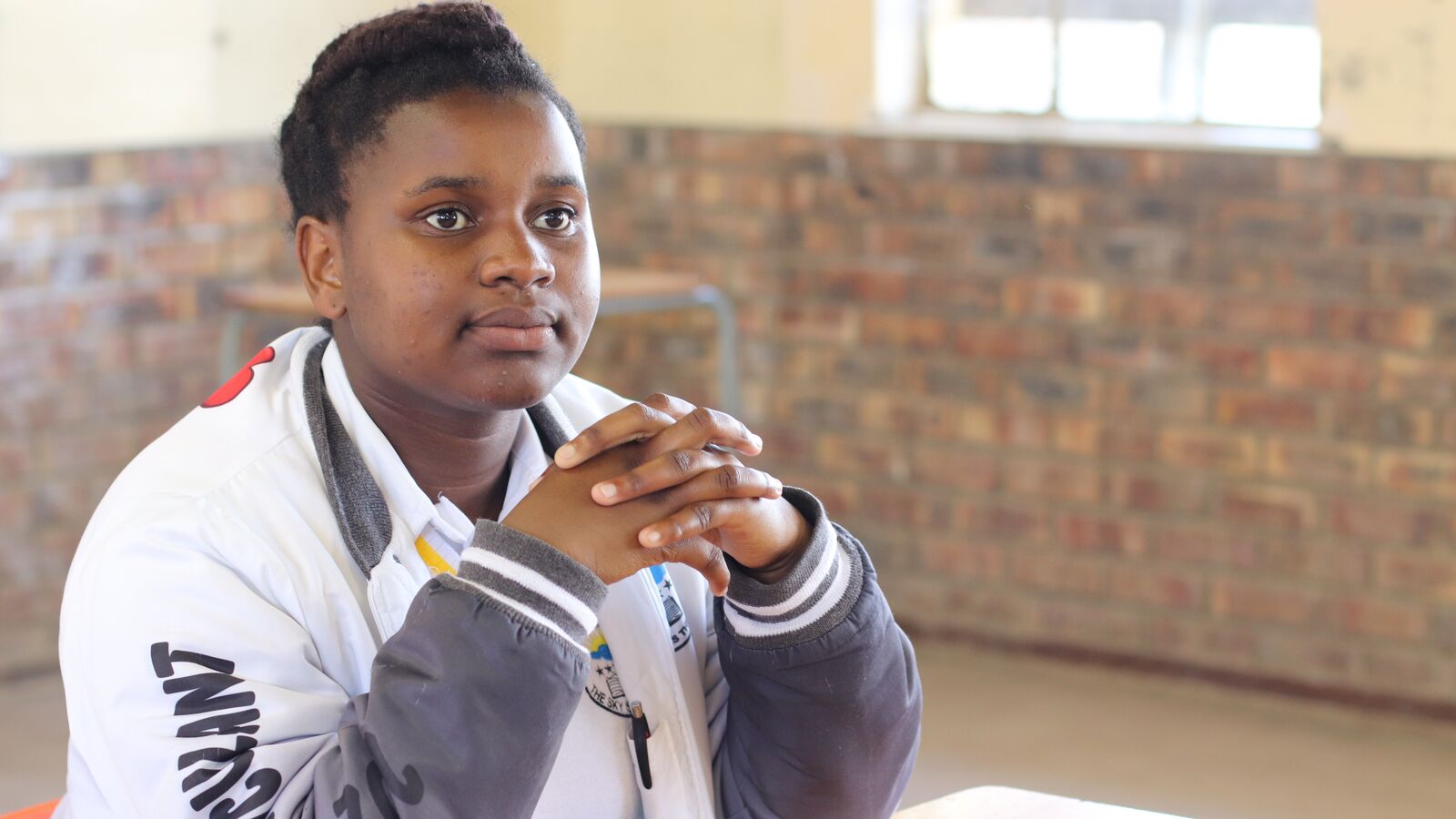 A student in South Africa sits at their desk