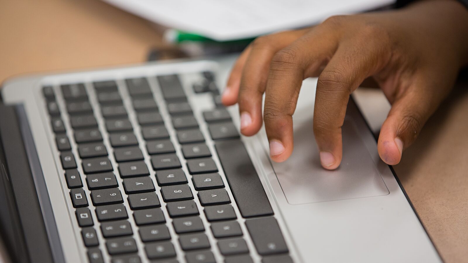 A student types on a laptop computer