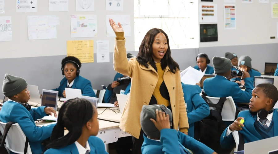 A teacher in a classroom with her students.